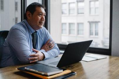 Man learning on his computer from a remote location