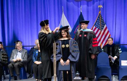 Doctoral graduate being hooded at Northwood Winter Commencement